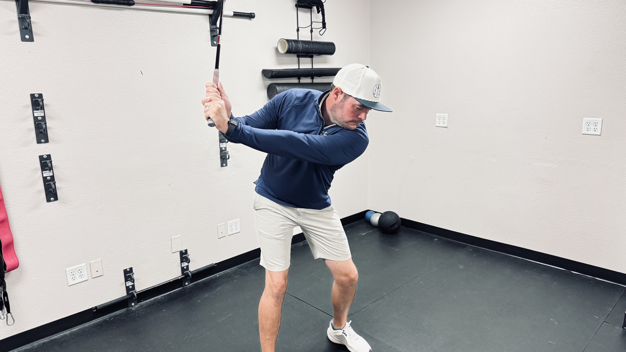 Golfer at the top of the backswing in Fort Worth — where the downswing force actually begins