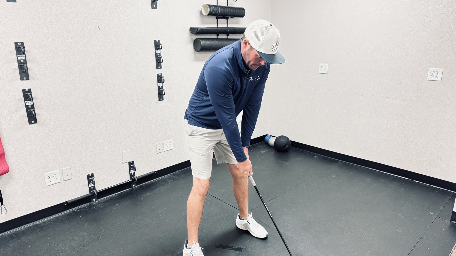 Dr. Jeremy Taylor in golf setup posture during a TPI movement assessment in Fort Worth, TX